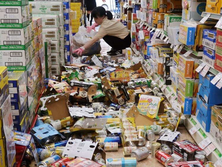 Shop items litter the floor of a convenience store, following the earthquake in Hirakata, Osaka