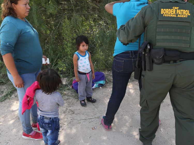 Border Patrol agents take Central American asylum seekers into custody near McAllen, Texas