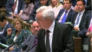 a group of people standing in front of a crowd: Mr Davis urged MPs to accept that the Brexit Bill now had to complete its passage through the Houses of Parliament