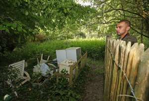 a man sitting on a bench in a garden: 19-jun-nh-hampstead-heath-031E.JPG.jpg