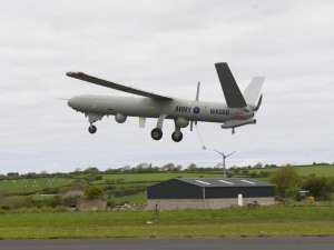 a large passenger jet flying through the air: web-watchkeeper-drone-rex.jpg