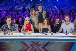 a group of people posing for the camera: In 2015 Olly joined the new line-up of the X Factor, which lasted just one year