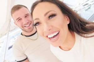 a man and a woman smiling for the camera: Sophie with boyfriend Aaron Armstrong