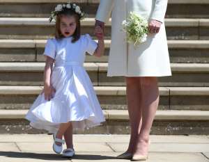 Britain's Princess Charlotte (L) leaves St George's Chapel in Windsor Castle after the royal wedding ceremony of Prince Harry, Duke of Sussex and Meghan, Duchess of Sussex in Windsor, Britain, 19 May 2018. The couple have been bestowed the royal titles of Duke and Duchess of Sussex on them by the British monarch.  NEIL HALL/Pool via REUTERS