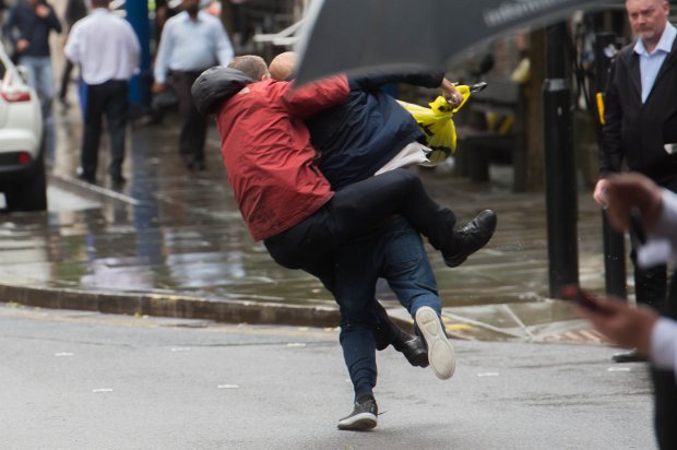 Security guards take down and restrain a street thief after he snatched ??170 from a woman as she used a Tesco Cash machine on Market st in Manchester. Crowds soon formed and arguments broke out as certain members of the public wern't happy with the heavy treatment of the thief as they held him down waiting for the Police to arrive. Disclaimer: While Cavendish Press (Manchester) Ltd uses its' best endeavours to establish the copyright and authenticity of all pictures supplied, it accepts no liability for any damage, loss or legal action caused by the use of images supplied. The publication of images is solely at your discretion. For terms and conditions see http://www.cavendish-press.co.uk/pages/terms-and-conditions.aspx