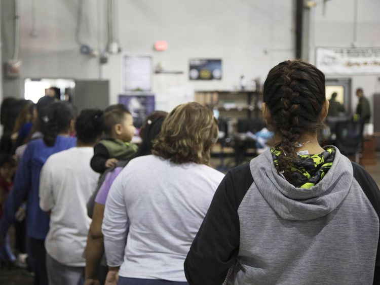 Women stand in line at the McAllen facility in Texas