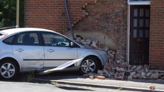 Car crashed into house