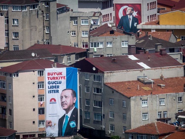 Election posters show Turkey&#39;s President Recep Tayyip Erdogan, left, and Mustafa Kemal Ataturk 