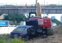 Report: Woman critically injured after slamming into parked excavator off Highway 401