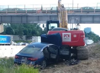 Report: Woman critically injured after slamming into parked excavator off Highway 401