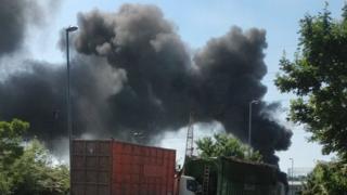 The view of the plume of smoke from the road