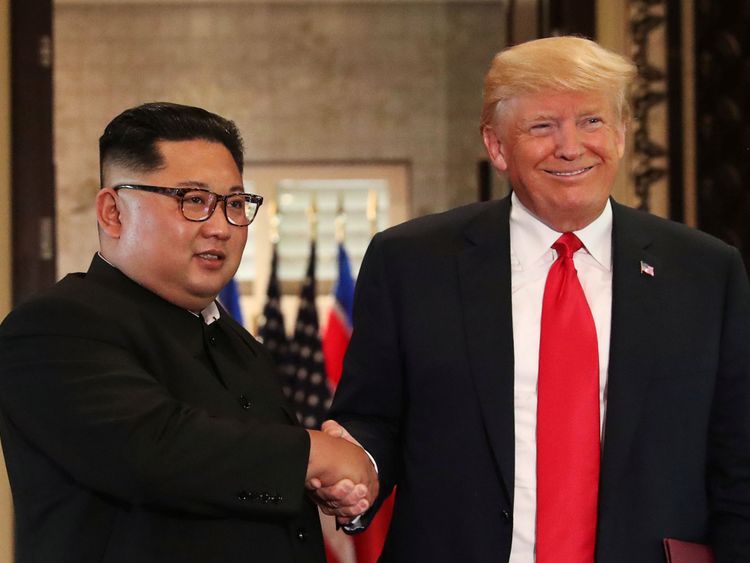 U.S. President Donald Trump and North Korea&#39;s leader Kim Jong Un shake hands after signing documents during a summit at the Capella Hotel on the resort island of Sentosa, Singapore June 12, 2018