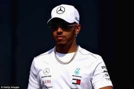 a man wearing a uniform: Lewis Hamilton has revealed he is 'closer than ever' to signing a new contract with Mercedes