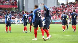 France's Blaise Matuidi, right holds up France's Kylian Mbappe's hand as they celebrate after Mbappe scored the opening goal of the game during the group C match between France and Peru at the 2018 soccer World Cup in the Yekaterinburg Arena in Yekaterinburg, Russia, Thursday, June 21, 2018. (AP Photo/David Vincent)