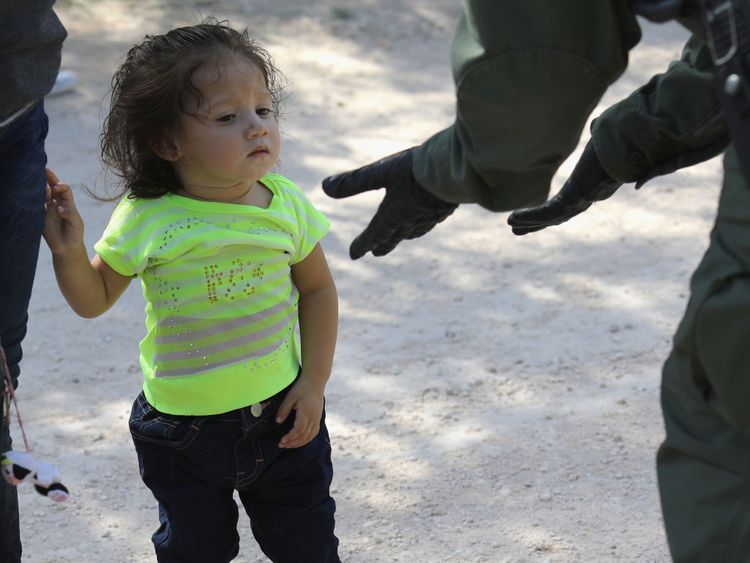 Border Patrol agents take Central American asylum seekers into custody on June 12, 2018 near McAllen, Texas