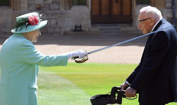 The Queen knighting Captain Tom last year